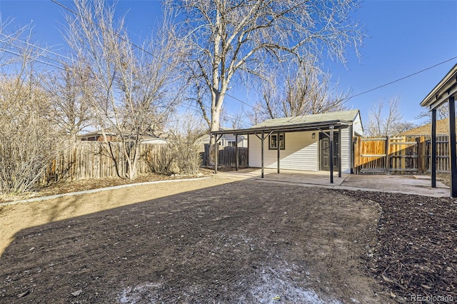 view of yard featuring fence and a patio