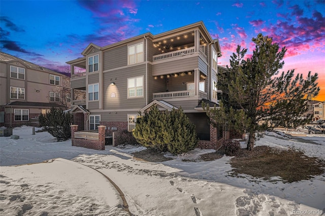 view of front of home with a balcony