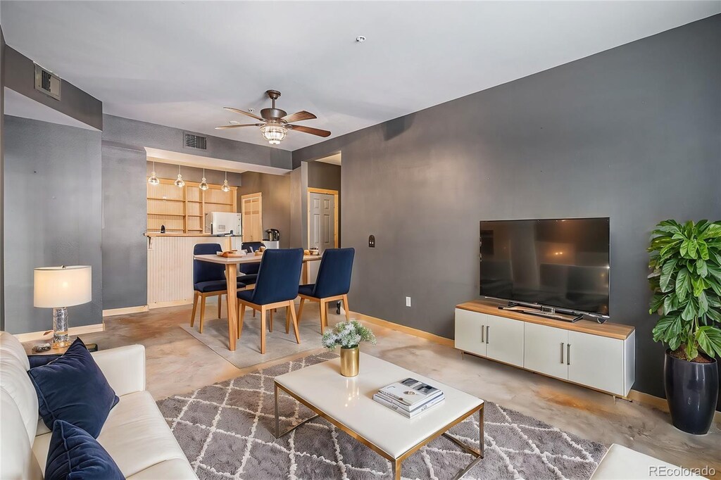 living room with ceiling fan