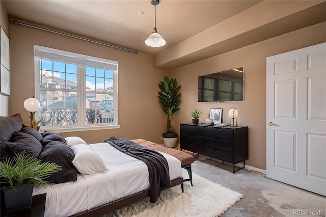 bedroom with concrete floors