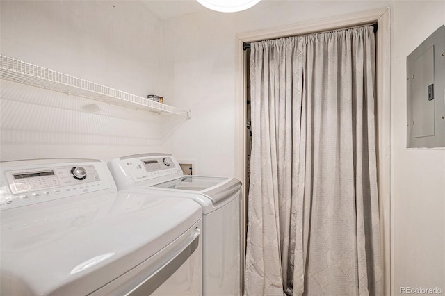 laundry area featuring electric panel and independent washer and dryer