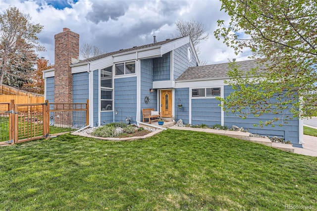 view of front of property with fence and a front yard