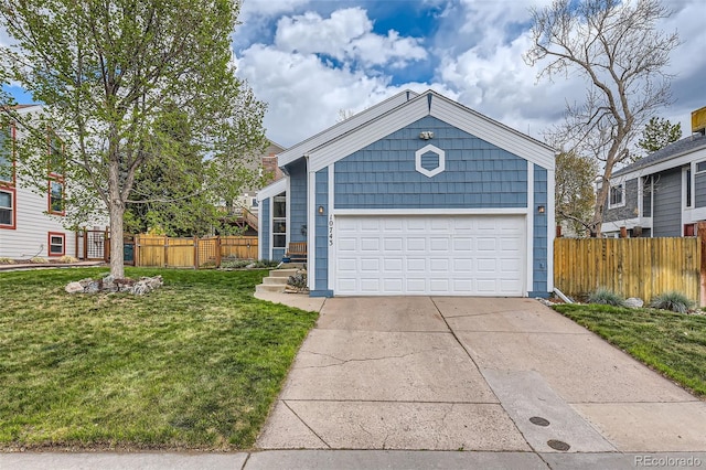 ranch-style house with a garage, fence, and a front lawn