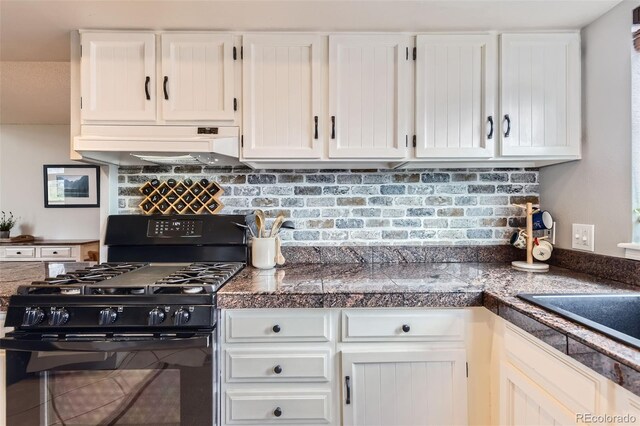 kitchen with custom exhaust hood, black range with gas stovetop, tile counters, white cabinetry, and tasteful backsplash
