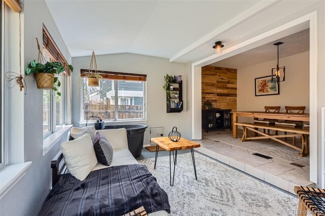 living room featuring vaulted ceiling