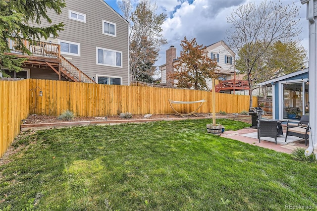view of yard with a fenced backyard and a patio area