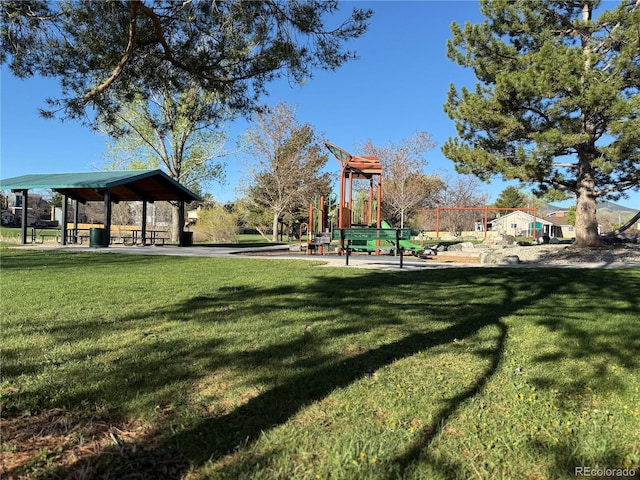 communal playground with a lawn and a gazebo