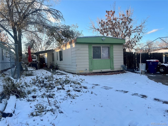 view of snow covered property