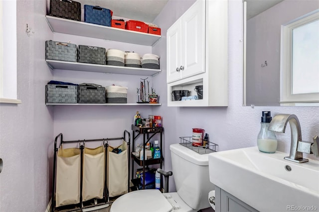 bathroom featuring sink and toilet