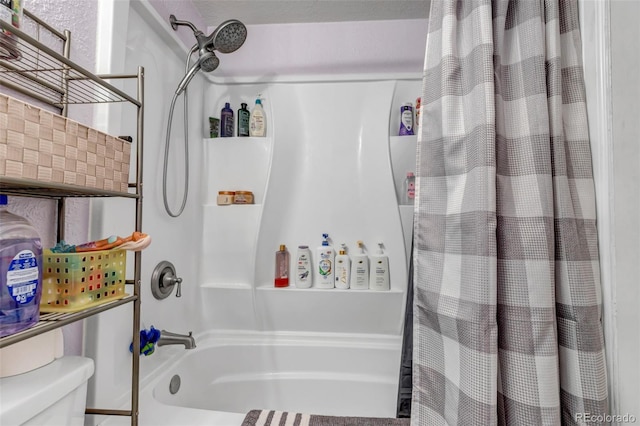 bathroom with toilet and shower / tub combo with curtain