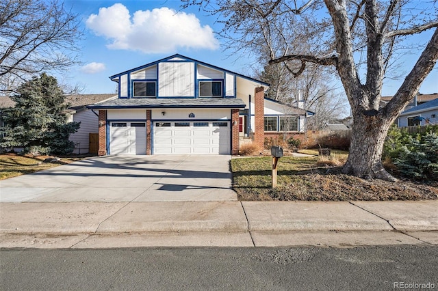 traditional-style house with brick siding, concrete driveway, and an attached garage