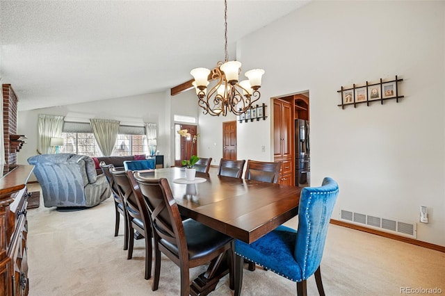 dining room with visible vents, light carpet, high vaulted ceiling, an inviting chandelier, and baseboards