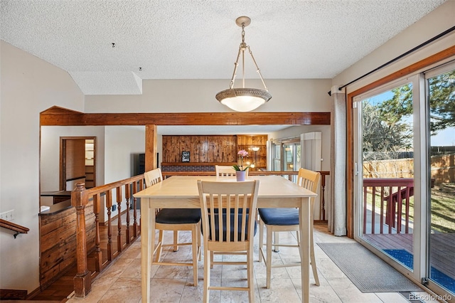 dining room featuring a textured ceiling