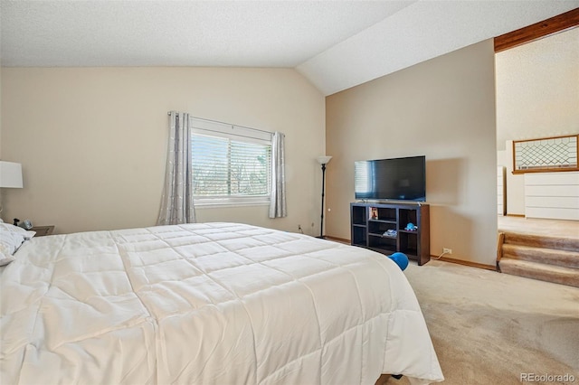 carpeted bedroom featuring baseboards and lofted ceiling