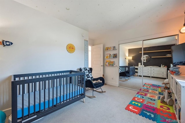 bedroom with carpet floors and a closet