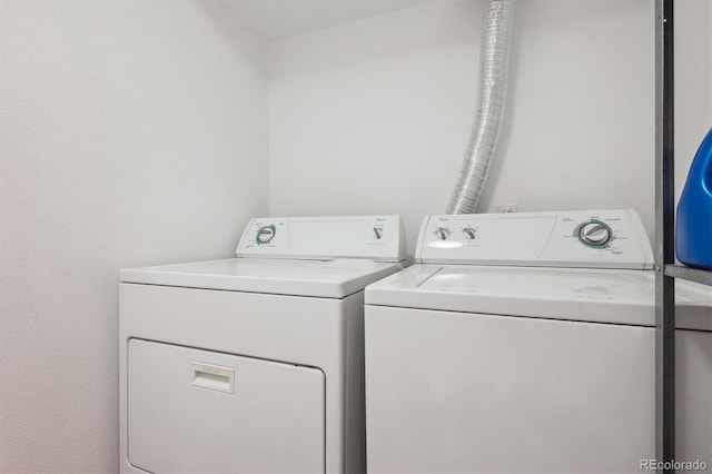laundry area featuring separate washer and dryer and laundry area