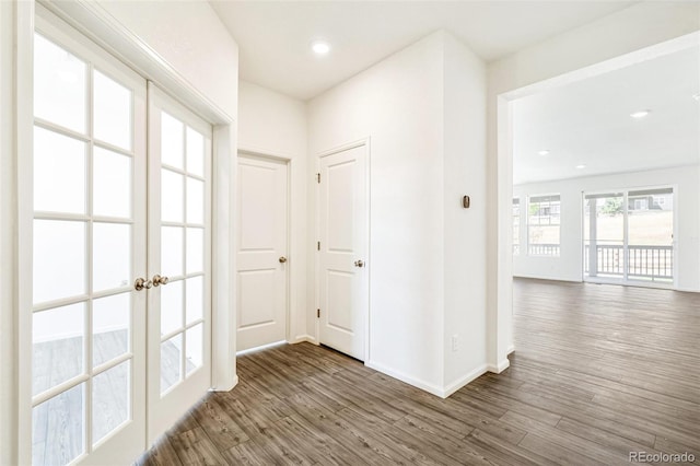 hall featuring dark hardwood / wood-style floors and french doors