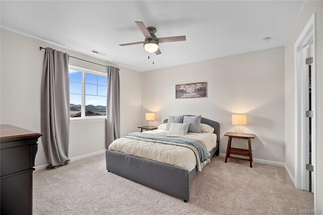 bedroom with light colored carpet and ceiling fan