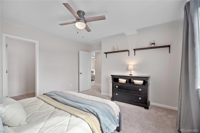 bedroom featuring ceiling fan and light carpet