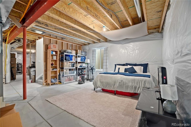 bedroom featuring concrete flooring