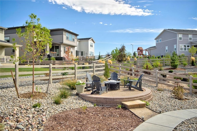 view of yard featuring a patio and an outdoor fire pit