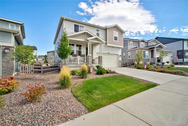 craftsman house with covered porch, a garage, and a front yard