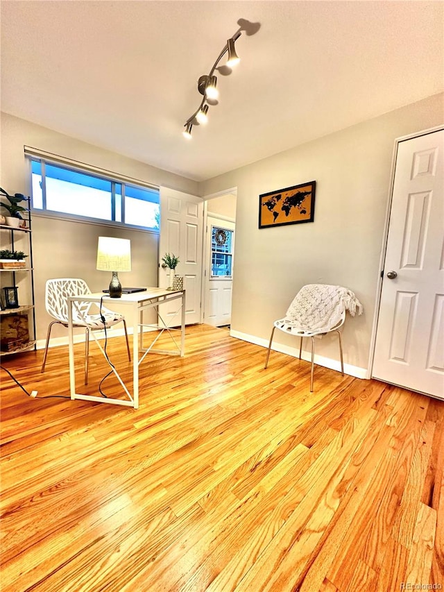 office space with light wood-type flooring