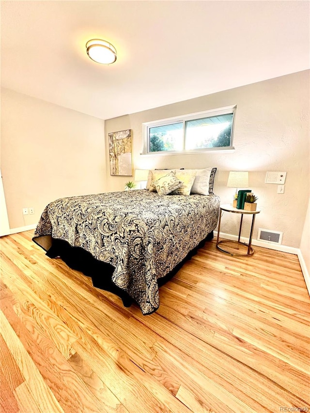 bedroom featuring light wood-type flooring