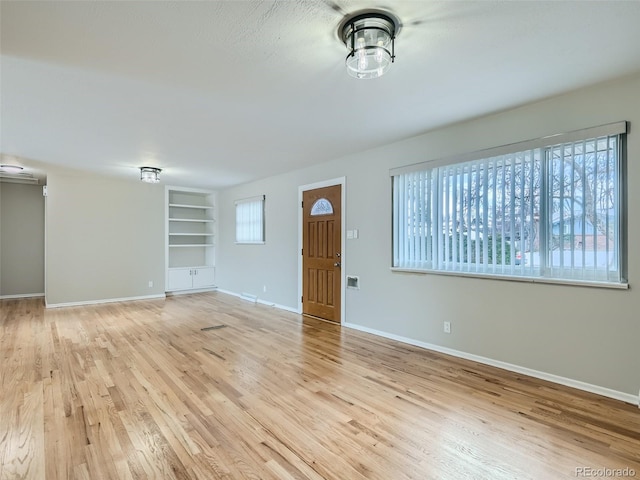 foyer with light hardwood / wood-style flooring