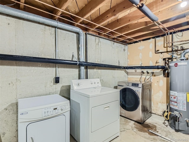 laundry room featuring gas water heater and independent washer and dryer