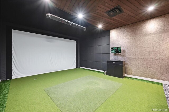 game room with golf simulator and carpet floors