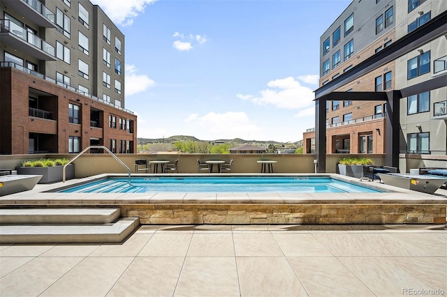 view of swimming pool featuring a mountain view