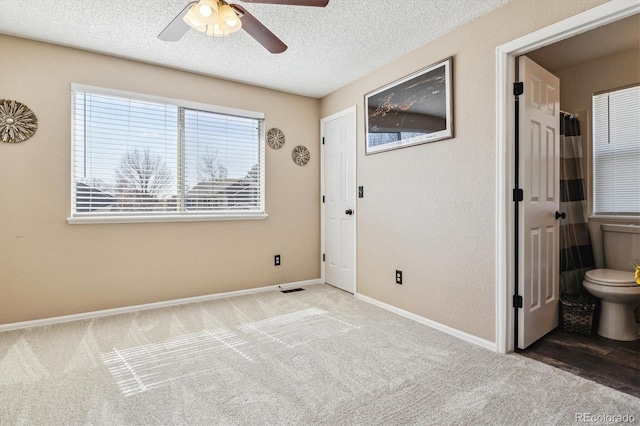 12559 W Crestline Dr, Littleton, CO 80127 - carpeted spare room with visible vents, baseboards, a ceiling fan, and a textured ceiling