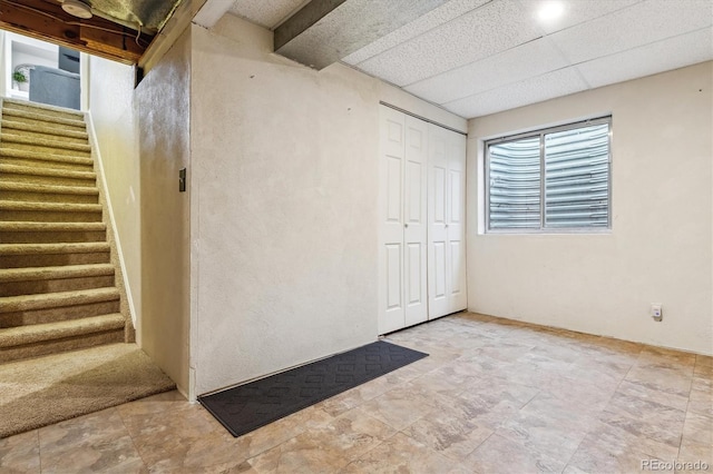 12559 W Crestline Dr, Littleton, CO 80127 - basement with stone finish flooring and stairway