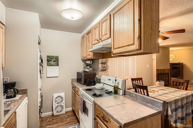 1250 S Monaco Street Parkway Unit 49, Denver, CO 80224 - kitchen with white electric range, under cabinet range hood, a textured ceiling, wood finished floors, and black microwave