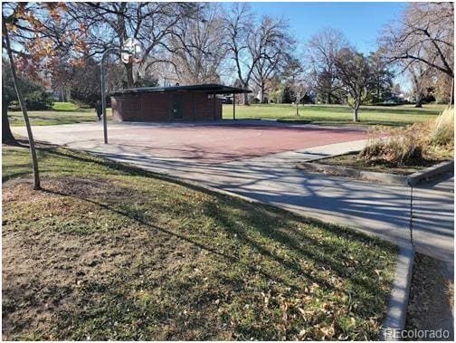 1250 S Monaco Street Parkway Unit 49, Denver, CO 80224 - view of property's community featuring a yard, driveway, and a carport
