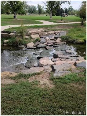1250 S Monaco Street Parkway Unit 49, Denver, CO 80224 - view of green lawn