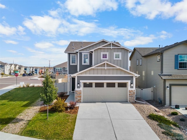 view of front of property featuring a front lawn and a garage