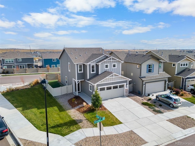 view of front of house featuring a front yard and a garage