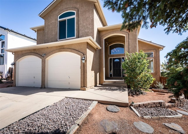 view of front of property with a garage