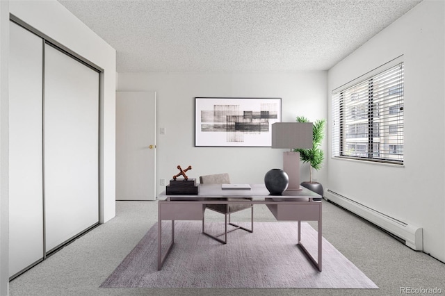 carpeted home office with a baseboard radiator and a textured ceiling