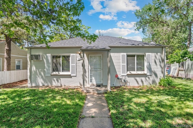 1177 Wabash St, Denver, CO 80220 - bungalow-style home with roof with shingles and concrete block siding