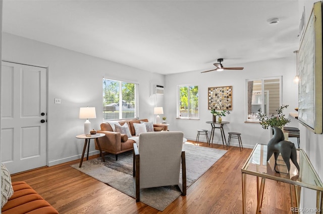 1177 Wabash St, Denver, CO 80220 - living area with a ceiling fan, wood finished floors, and baseboards