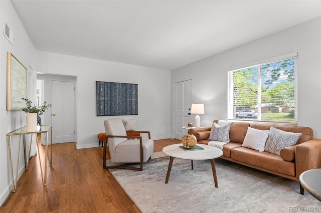 1177 Wabash St, Denver, CO 80220 - living area with wood finished floors and baseboards