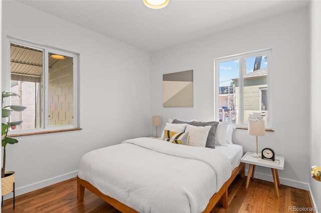 1177 Wabash St, Denver, CO 80220 - bedroom with baseboards and wood finished floors