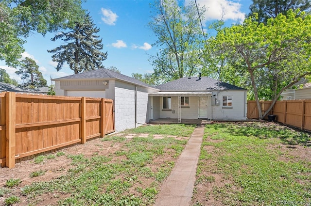 1177 Wabash St, Denver, CO 80220 - back of house featuring a patio and a shingled roof