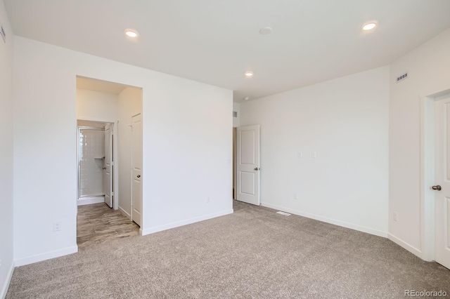 unfurnished bedroom with baseboards, carpet flooring, and recessed lighting
