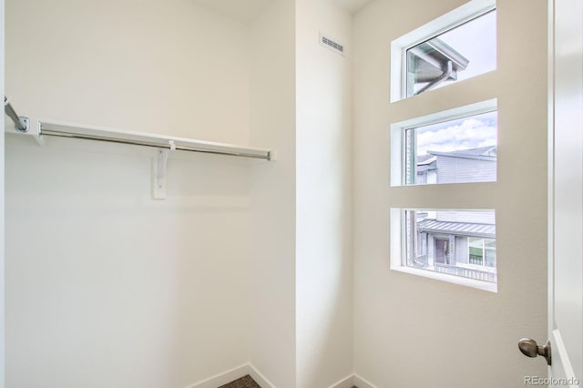 walk in closet with visible vents