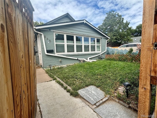 back of house with a yard