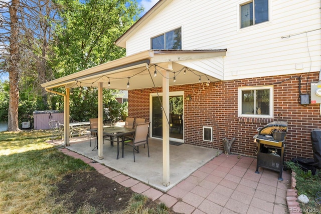 view of patio with a hot tub